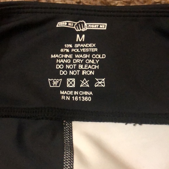 Feed me fight me peacock leggings. Half black and half peacock design. - Picture 2 of 3